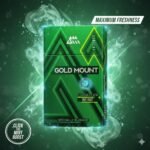 ซองบุหรี่ Gold Mount Flavour Click Mint สีเขียวเมทัลลิก ดีไซน์ทันสมัย มีกราฟิกควันสีเขียวและเอฟเฟกต์ความเย็นรอบซอง พร้อมข้อความ Maximum Freshness